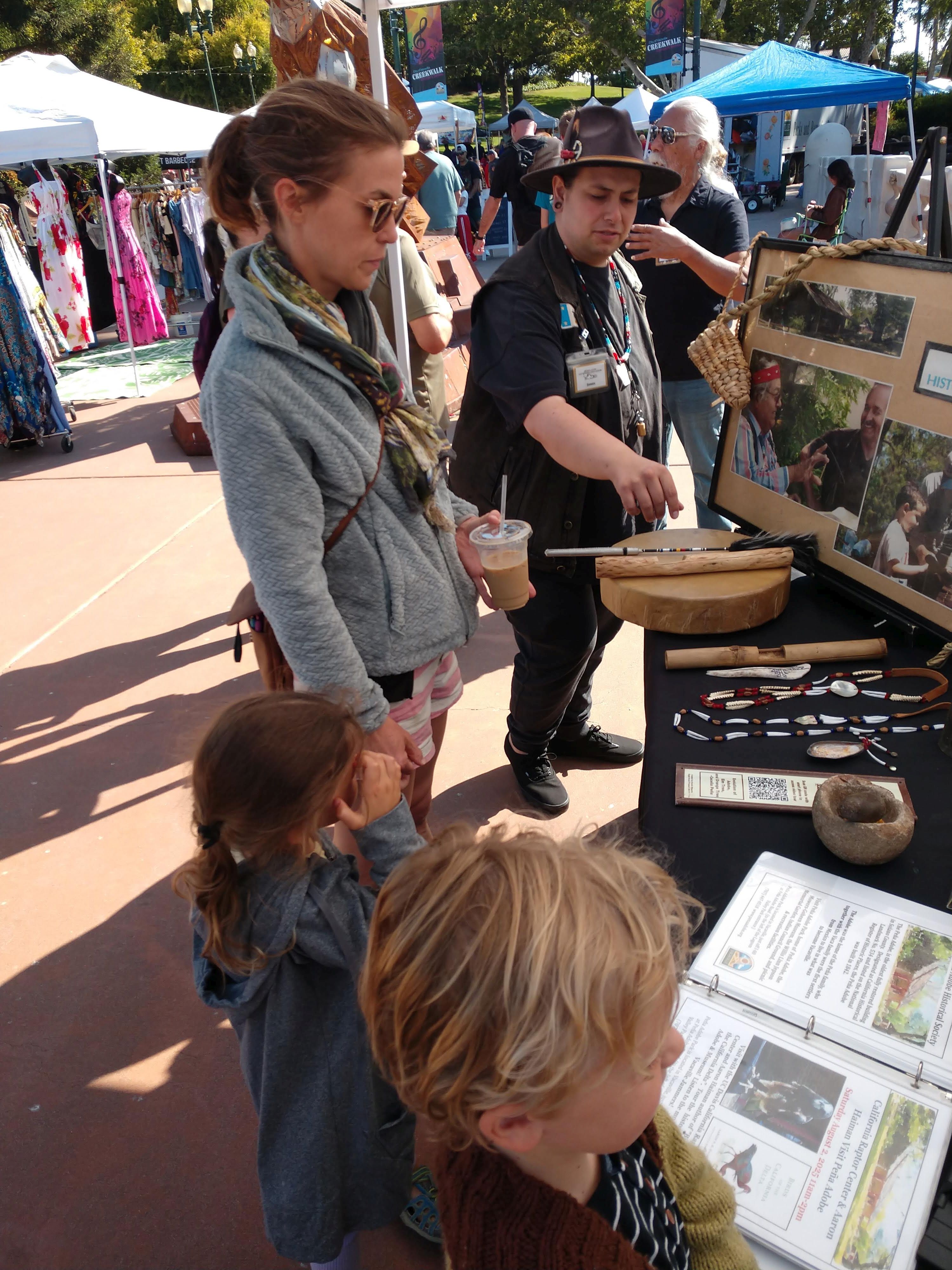 Peña Adobe Historical Society Docents Armando & James chat with visitors at the Vacaville's Farmers Market 