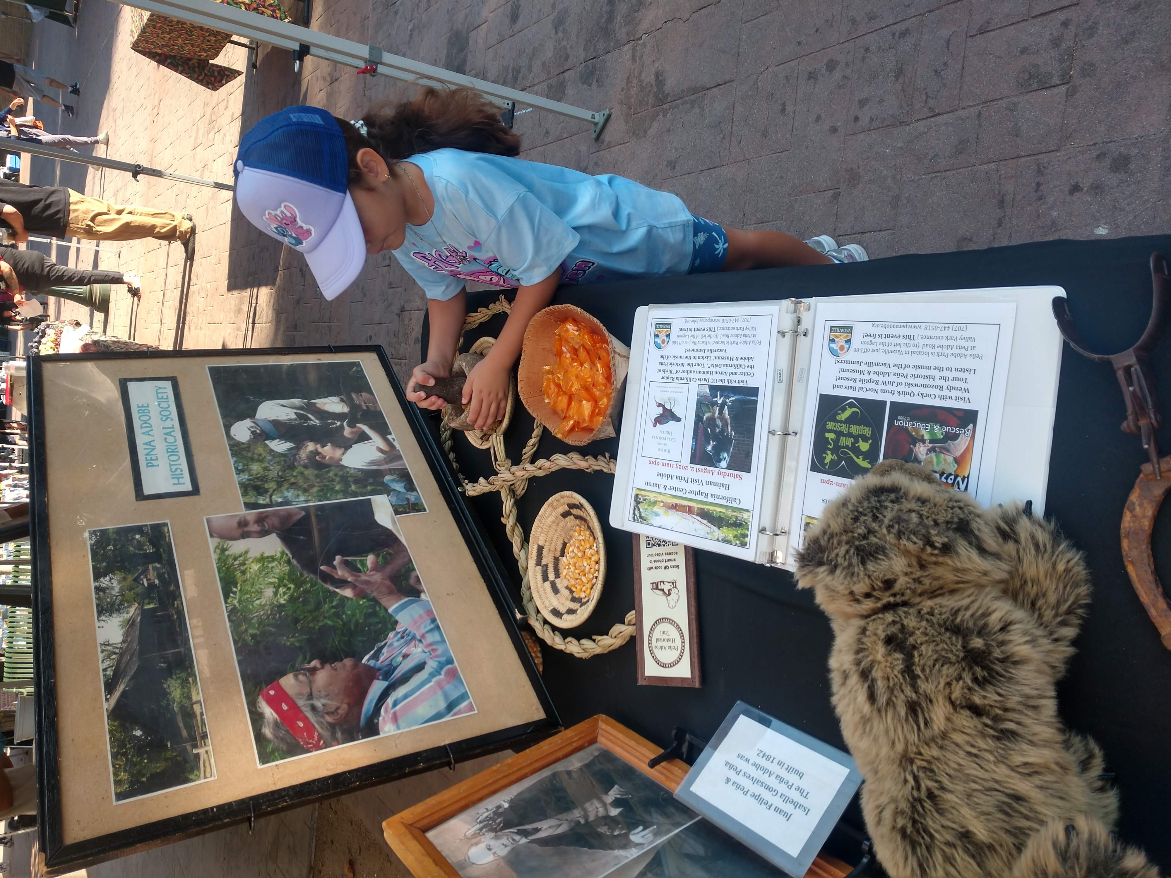 Young visitor at last year's Vacaville's Farmers Market!