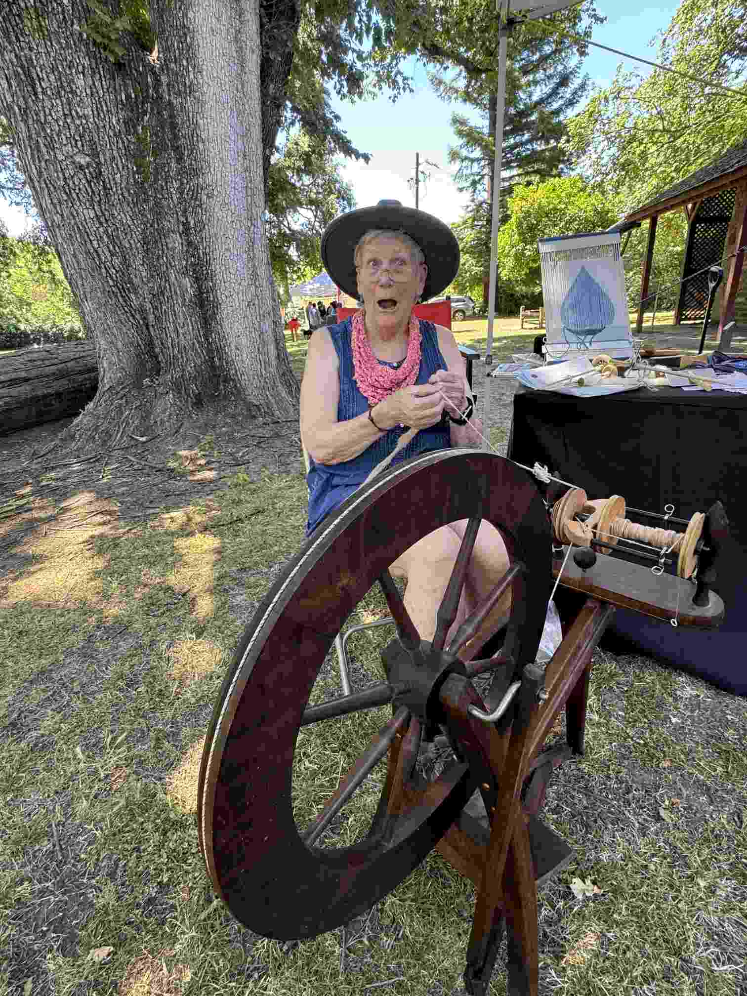 Silverado Handweavers and Spinners Guild member Jody Lane spinning yarn at Peña Adobe!