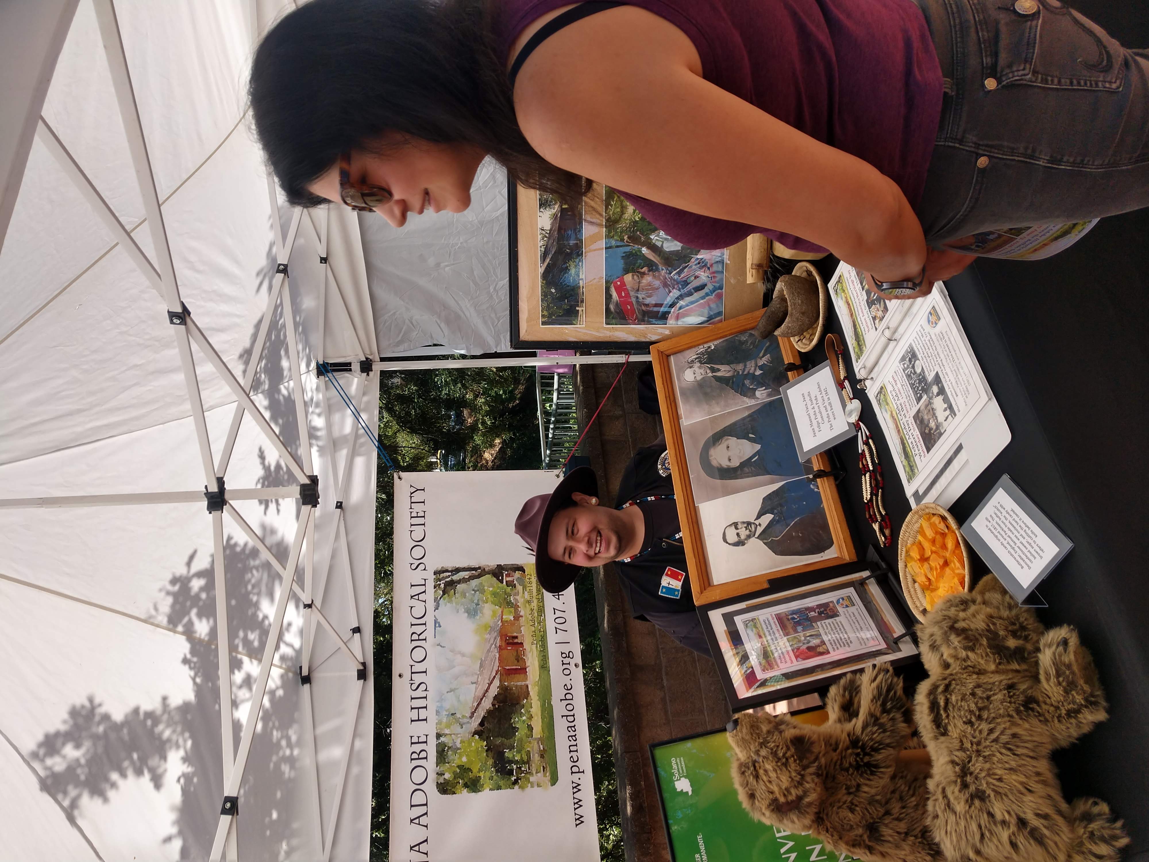 Peña Adobe Historical Society Docent James Tunstall chats with visitor at the Vacaville's Farmers Market!